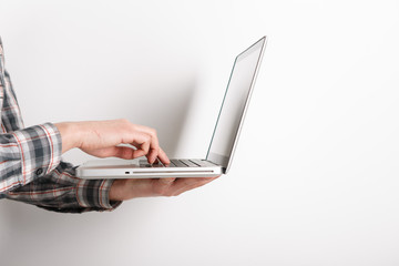 Laptop with man hand isolated