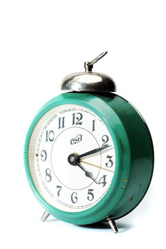 Retro alarm clock on a white background