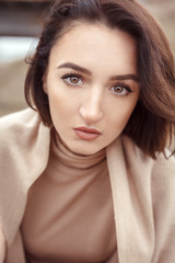Naklejka premium beautiful portrait of pretty girl with short hair looking to the camera