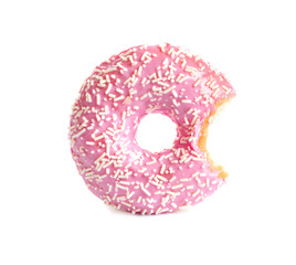 Delicious bitten doughnut with sprinkles on white background