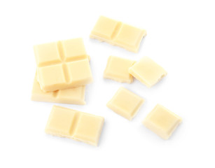 Delicious chocolate pieces on white background