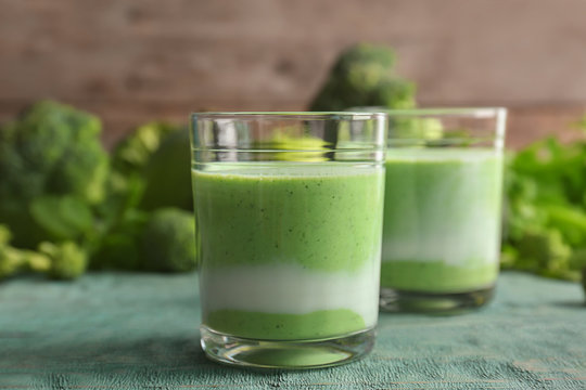 Glasses with healthy detox smoothie and ingredients on table