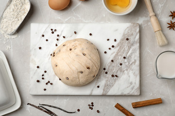 Flat lay composition with raw dough and products on grey background