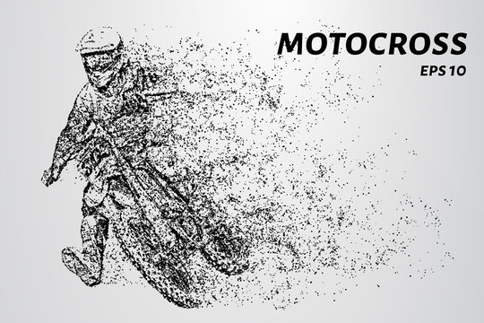 Motocross particles. The motorcyclist puts his leg when turning