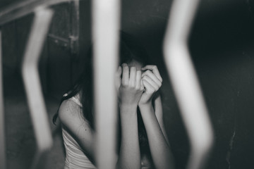 Female slavery in an abandoned building, ending violence against women, international women's day.