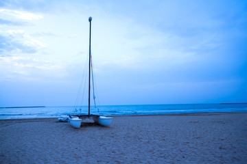 Row and sail boat on al hamra beach at Ras Al Khaima, UAE