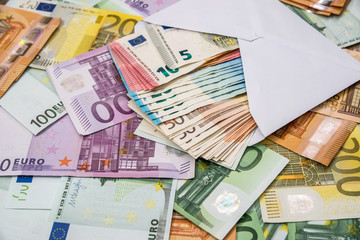euro in white envelope on euro banknotes
