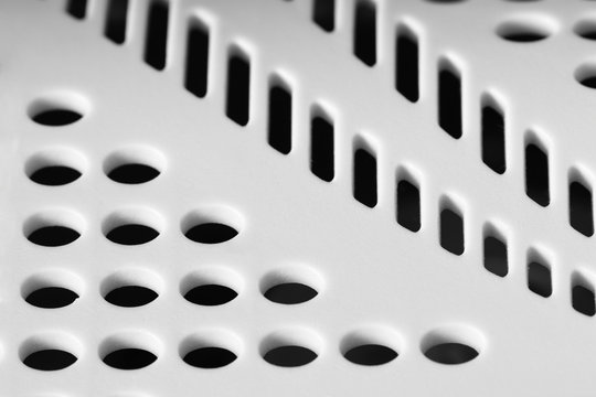 White Perforated Plastic Surface With Selective Focus