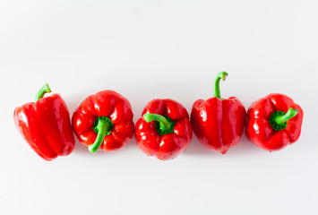 group of red ripe organic bell pepper  isolated on white. copy space
