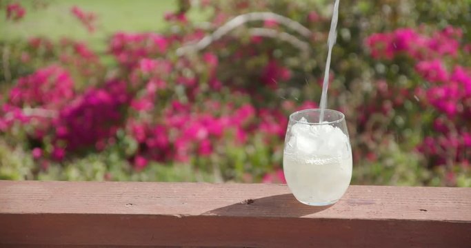 Lemonade poured over Ice on sunny day