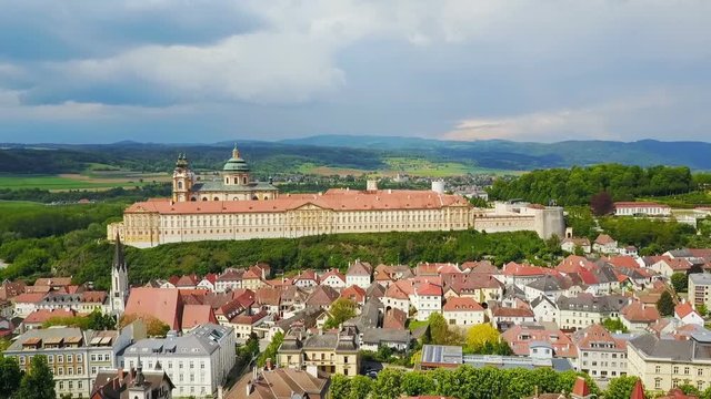 Melk Abbey Monastery aerial panoramic view. Stift Melk is a Benedictine abbey in Melk, Austria. Monastery located on a rocky outcrop overlooking the Danube river and Wachau valley.