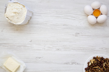Ingredients for making cookies on white wooden table. Top view. From above, flat lay. Copy space.