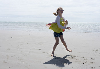 Girl dancing weirdly on the beach