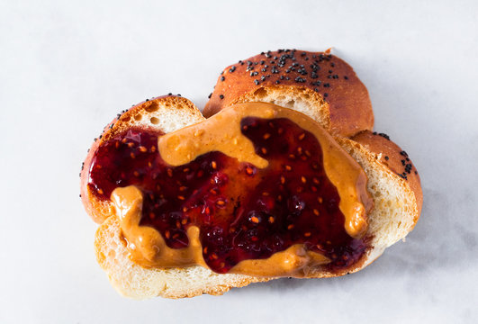 A Morning Breakfast With Braided Fresh Bread, Peanut Butter, Jam From Berries And A Cup Of Tea. Healthy Eating