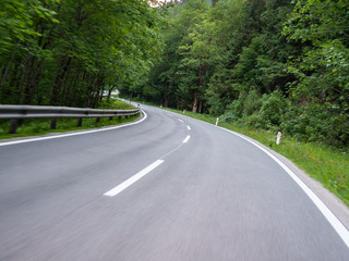 Fototapeta na wymiar Austrian countryside road in motion