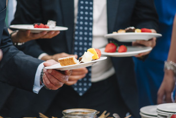 people with varied sweets in the dishes, concept hospitality, bars and restaurant