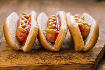 three classic hot dogs with ketchup and mustard