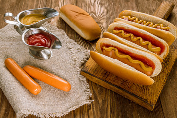 three classic hot dogs with ketchup and mustard