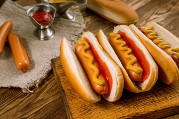 three classic hot dogs with ketchup and mustard