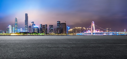  asphalt road and modern city skyline in Guangzhou at night,China