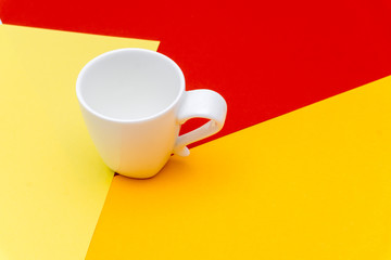white cup with colorful color