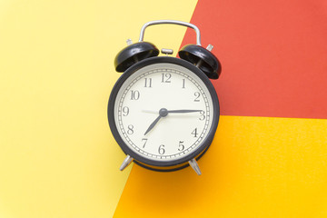 black bell clock with colorful colors