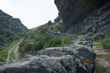 A rocky pathway winding along a mountain ridge