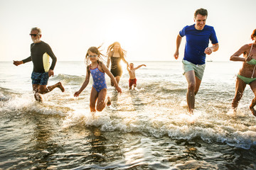 Family playing at the beach