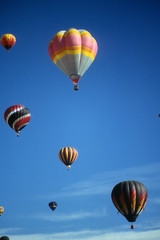 Hot air balloons against blue sky