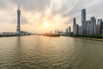 Guangzhou,China modern city skyline panorama on the zhujiang river at sunset