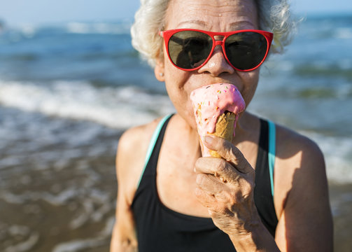 Senior woman eating an ice cream cone