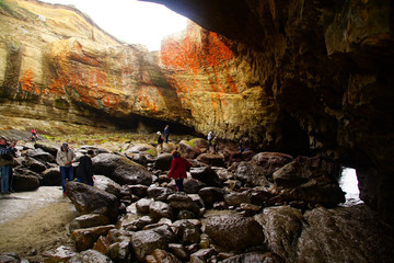 Tourists explore the interior of Devil's Punchbowl