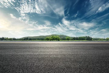 Poster Asphalt road and mountain with sky clouds landscape at sunset © ABCDstock