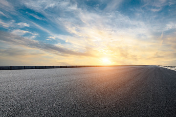 Empty asphalt road and sky cloud landscape at sunset