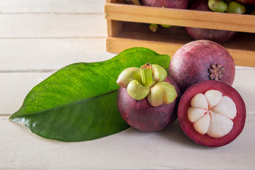 mangosteen  on white wooden table