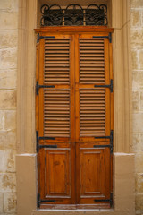 An old wooden vintage door of a historic building.