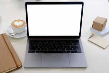 Fototapeta premium Business still life. Wood office desk table with laptop, cup of coffee and supplies. white wooden desk and copy space