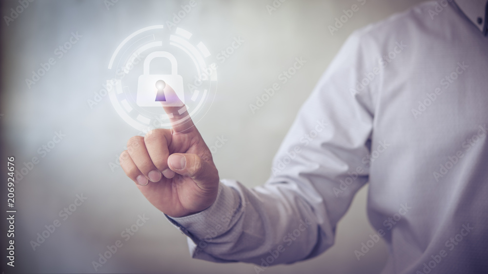 Aufkleber Person touching virtual button a shield with a lock symbol, concept about security, cybersecurity and protection against dangers