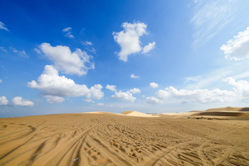 Fototapeta na wymiar White Sand Dunes with white cloudy and blue sky