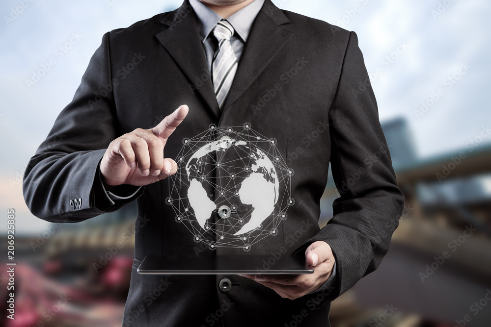 Poster businessman hand touching virtual button on earth map point with network connection, international m