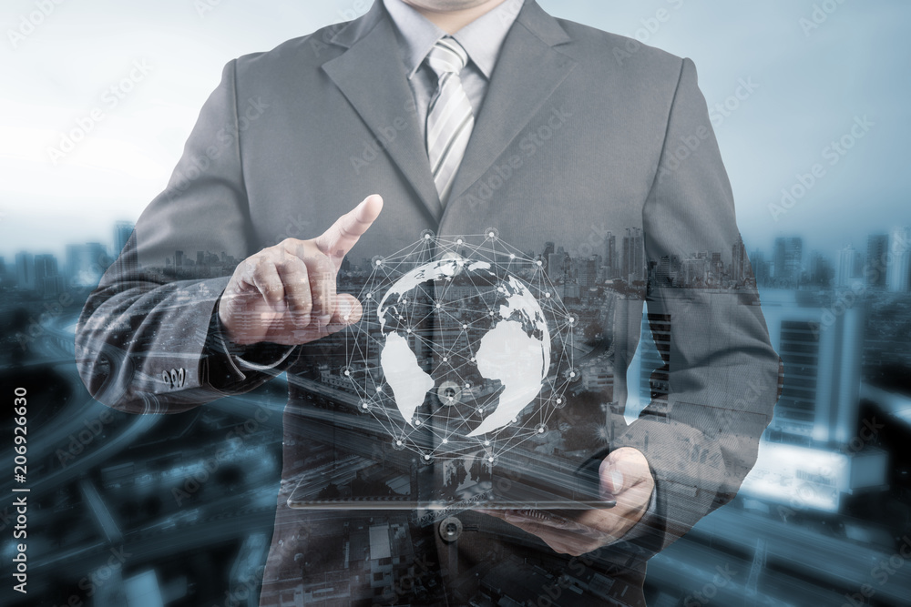 Poster businessman hand touching virtual button on earth map point with network connection, international m