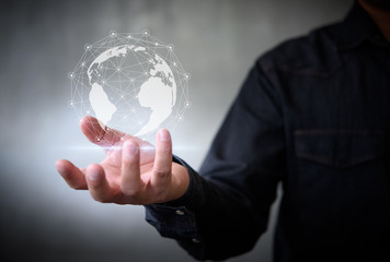 Businessman with virtual Earth map point with network connection on hand, international meaning