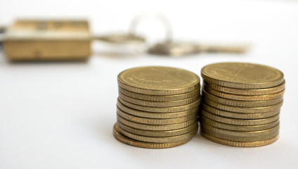 piles coins on white background.