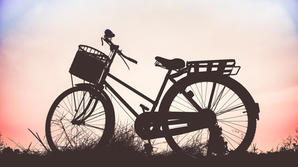 Fototapeta na wymiar beautiful landscape image with Bicycle at sunset in vintage tone style