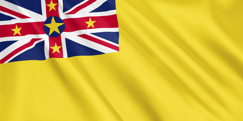 Niue flag waving with the wind, wide format, 3D illustration. 3D rendering.