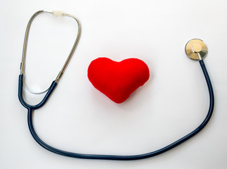 Red heart with stethoscope on white background, healthcare.