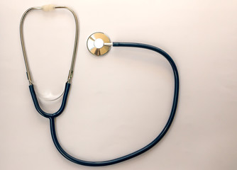 Red heart with stethoscope on white background, healthcare.