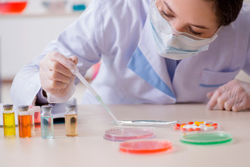 Lab assistant in drug synthesis concept