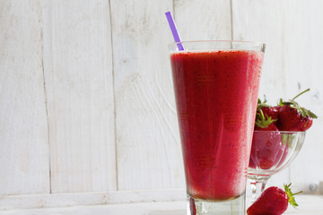 a tall glass of sweet strawberry cocktail