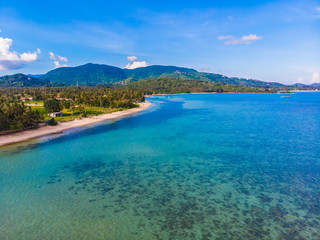 Fototapeta na wymiar Aerial view of beautiful tropical beach and sea with palm and other tree in koh samui island
